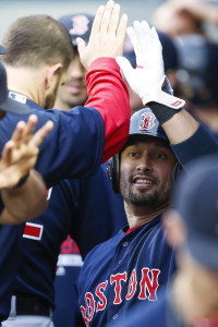 May 15, 2015; Seattle, WA, USA; Boston Red Sox right fielder Shane Victorino (18) gets a high-five in the dugout after scoring a run against the Seattle Mariners during the first inning at Safeco Field. Mandatory Credit: Joe Nicholson-USA TODAY Sports